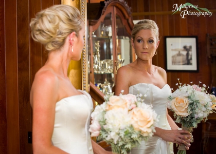 Bride looks into mirror. Pre-wedding images in Melbourne by Millgrove Photography.