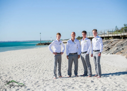 Groom and groomsmen on the beach