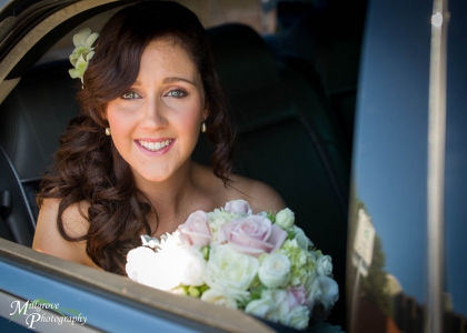 Bride Rachel in her wedding car
