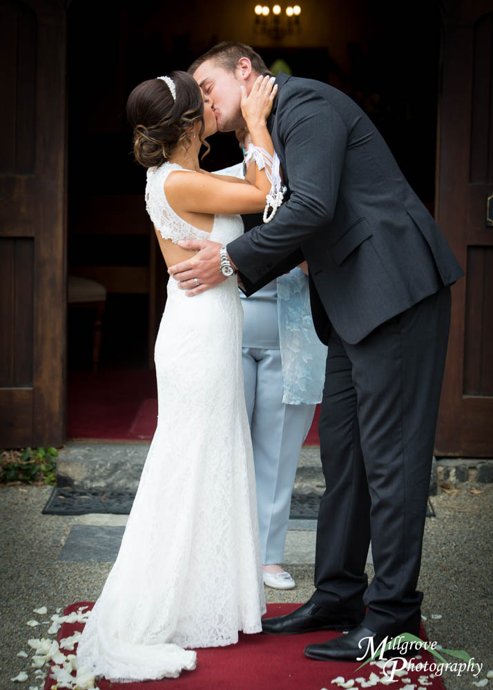 A bride and groom kissing