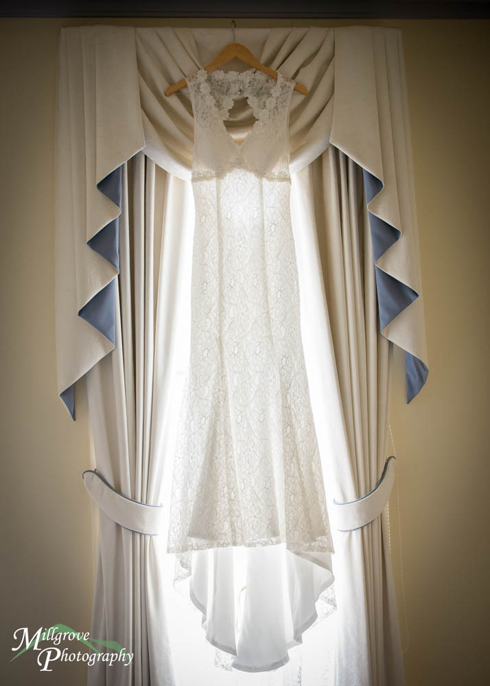 Bridal gown hanging in the window