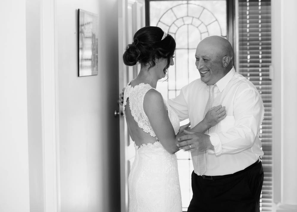 Bride and father sharing a moment, black and white