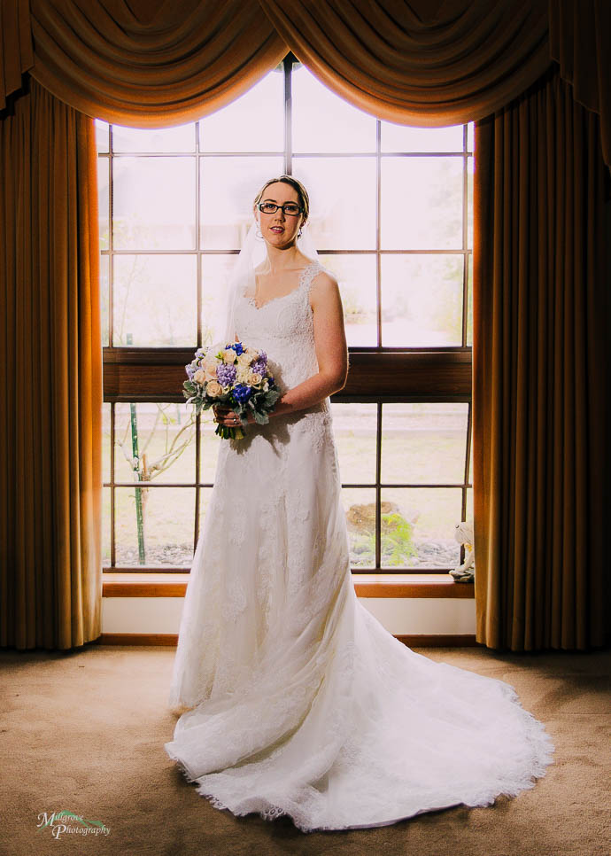 Bride in front of a picture window