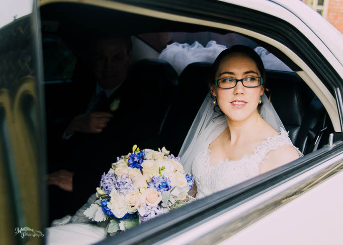Bride looking out of car window