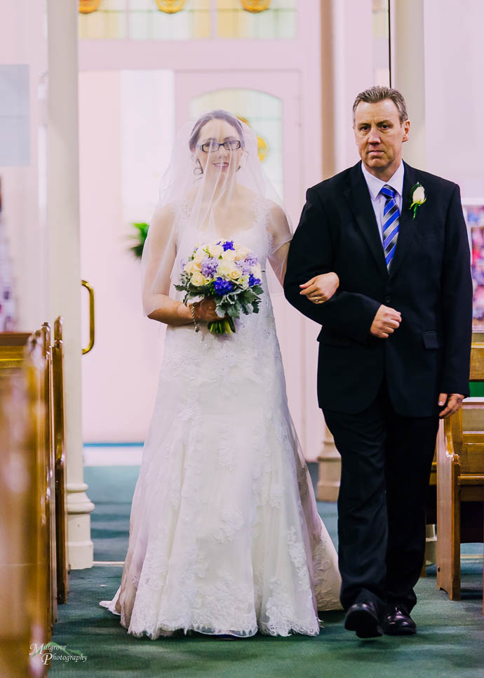 Bride and her father walking down the aisle
