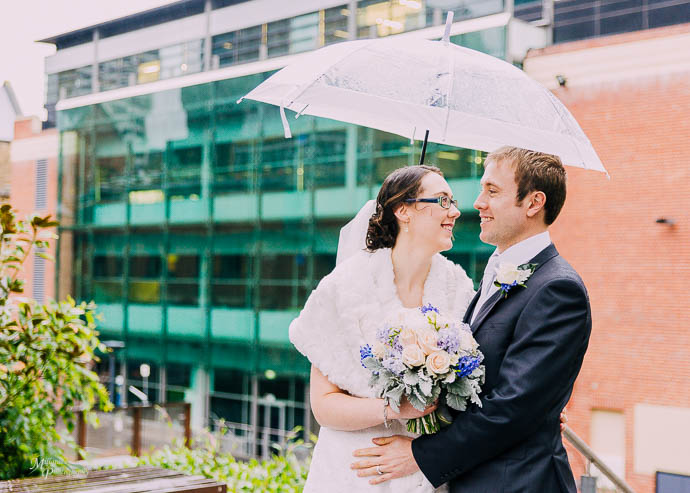 Bride and groom outside buildings at RMIT