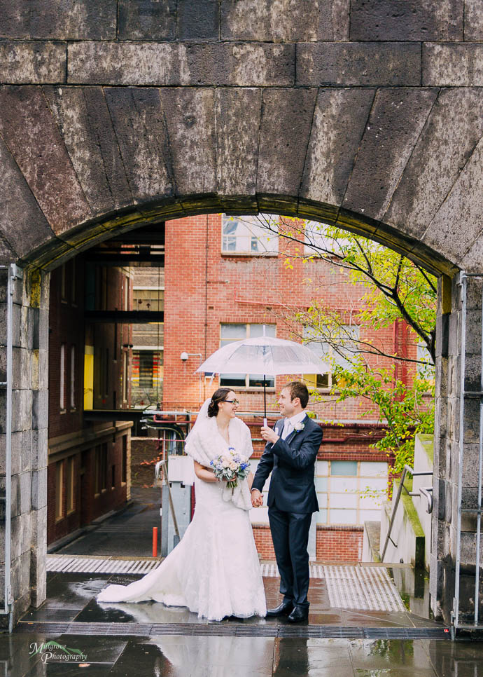 Bride and groom in an archway at RMIT