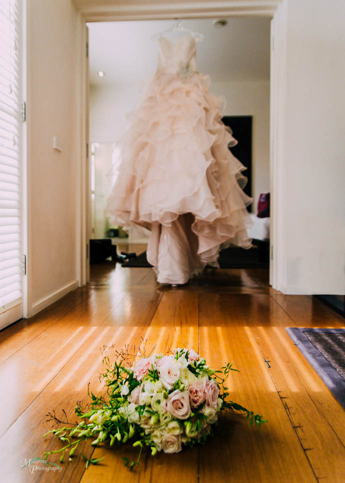 Dress with bouquet in the foreground