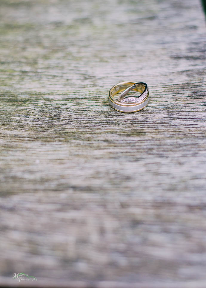 Wedding rings on a timber table