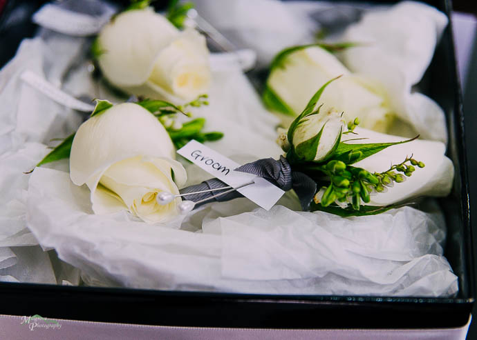 Close up of groom's buttonholes