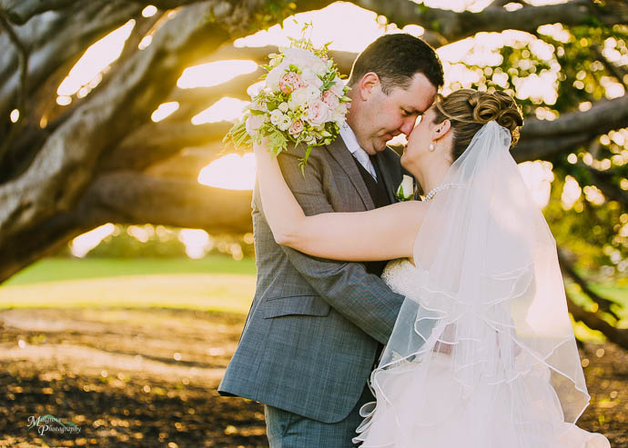 Bride and groom kissing in Catani Gardens, St Kilda, Melbourne