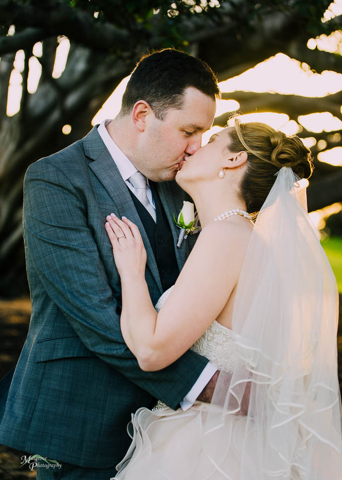 Bride and groom kissing in Catani Gardens, St Kilda, Melbourne