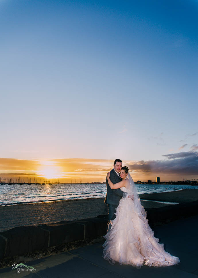 Sunset bride and groom at St Kilda