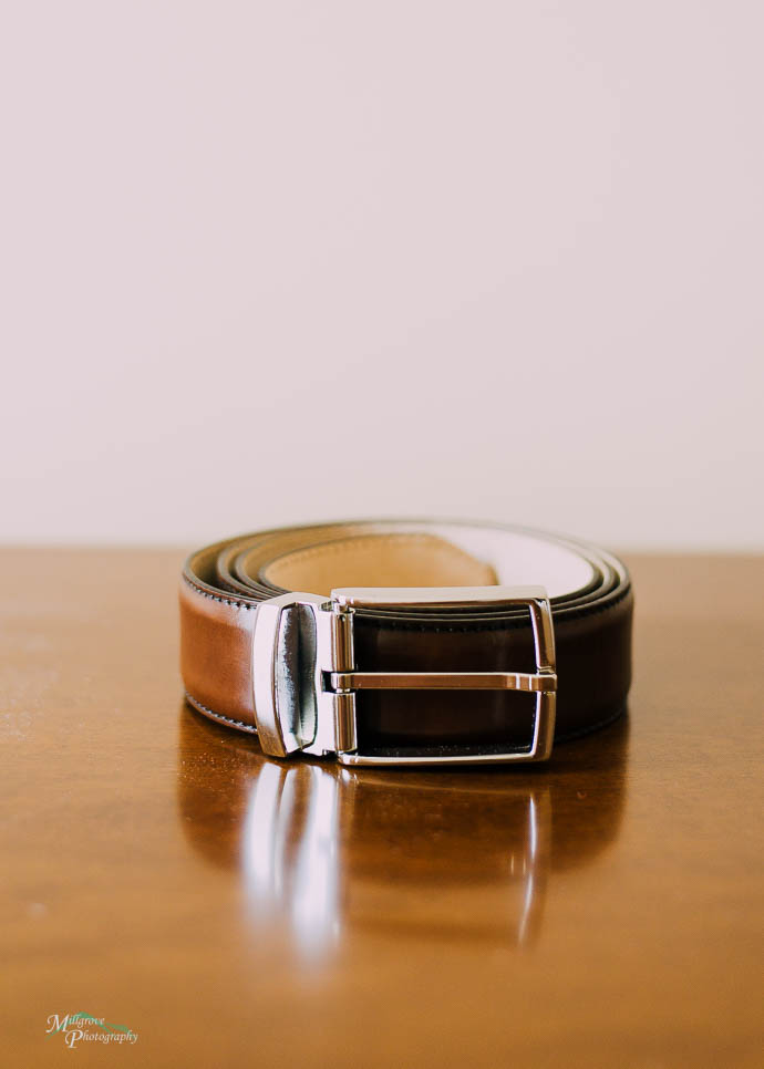 Groom's belt on a timber table