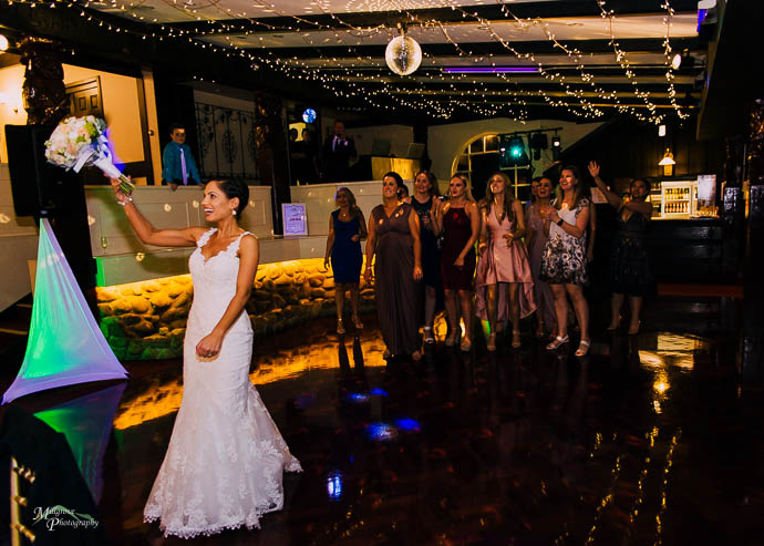 Bride tossing the bouquet at Chateau Wyuna