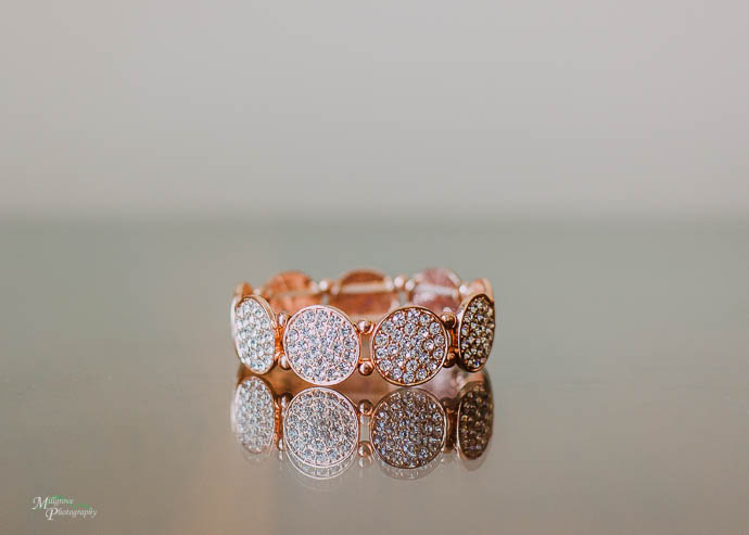 Bridal jewellery on a reflective glass table