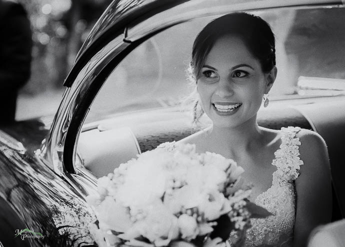 Bride in wedding car, black and white