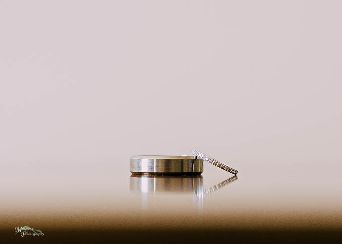 Wedding rings reflected on a table