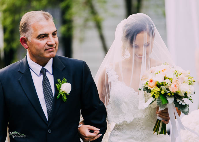 Bride and father walking down the aisle at Chateau Wyuna
