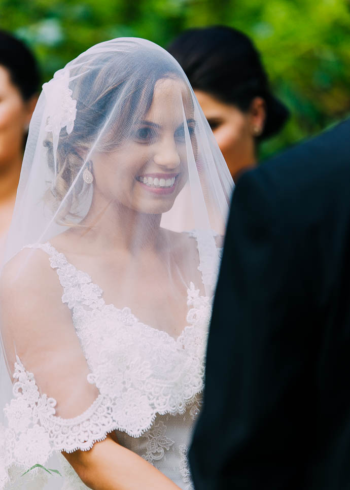 Beautiful smiling bride with veil down