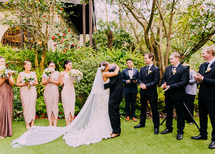 Bride hugging her father after wedding ceremony