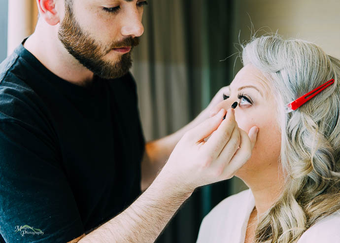 Bride getting her eye makeup done