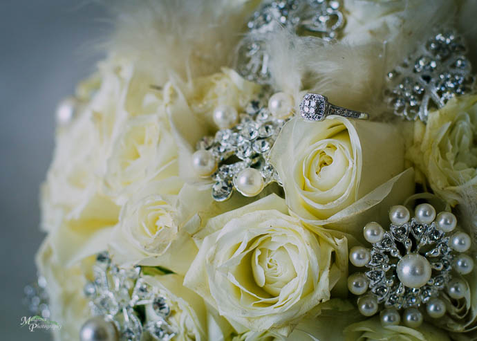 Engagement ring in the bride's bouquet