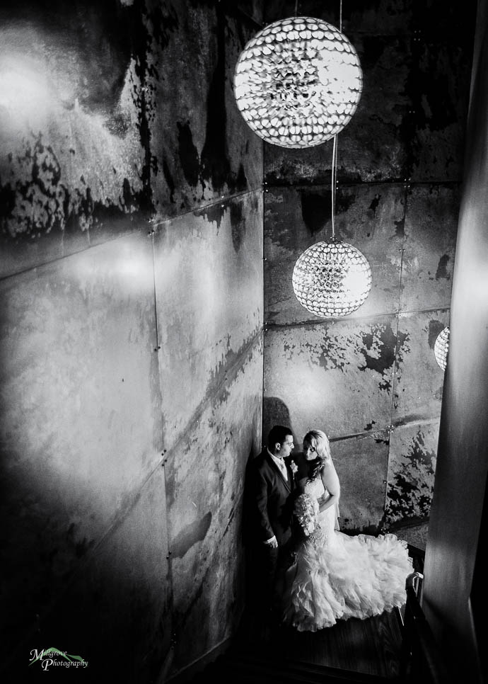 Bride and groom on the stairwell at All Smiles Melbourne Waterfr