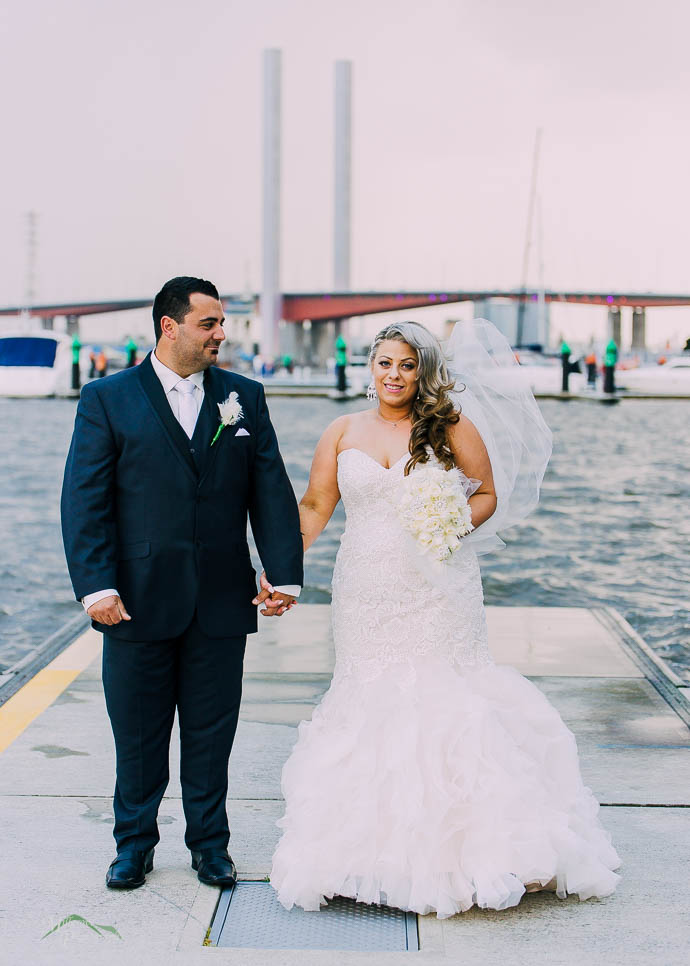 Bride and groom outside All Smiles Melbourne Waterfront on a co