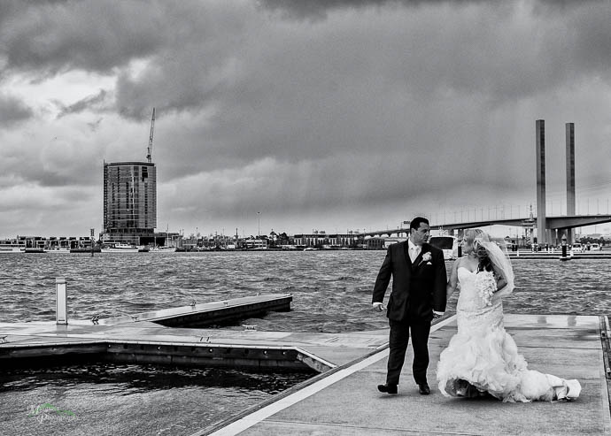 Bride and groom outside All Smiles Melbourne Waterfront on a co