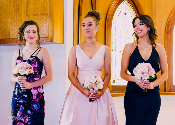 Smiling bridesmaids in the chapel
