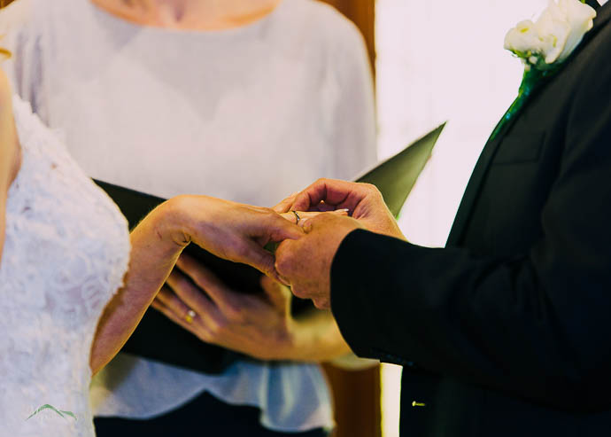 Bride and groom exchanging rings