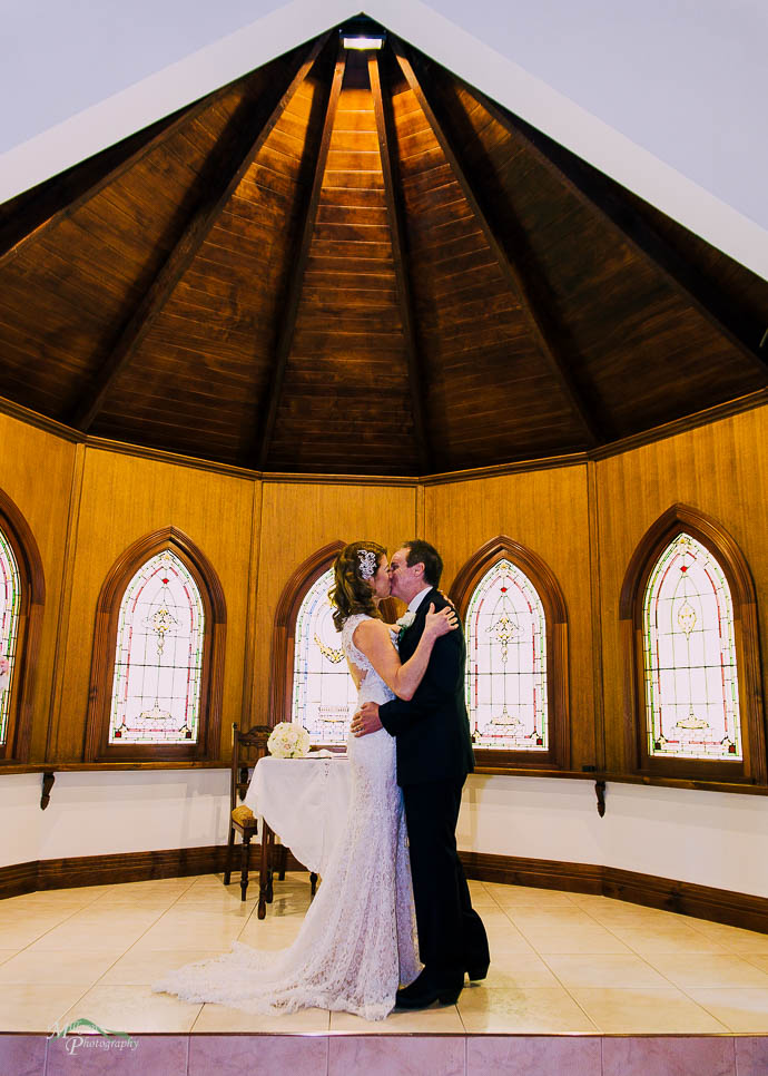 Bride and groom exchanging rings
