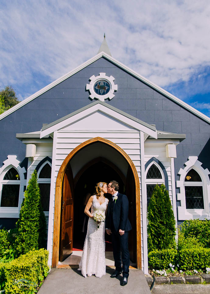 Kissing outside the chapel at Ballara Receptions