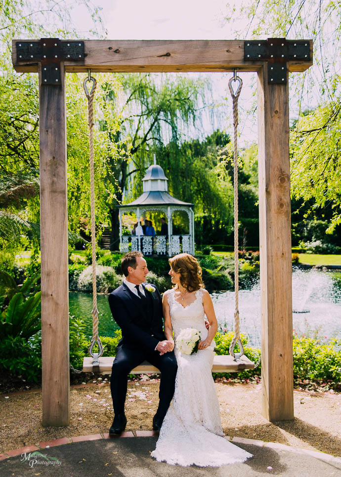 Bride and groom on the swing at Ballara Receptions