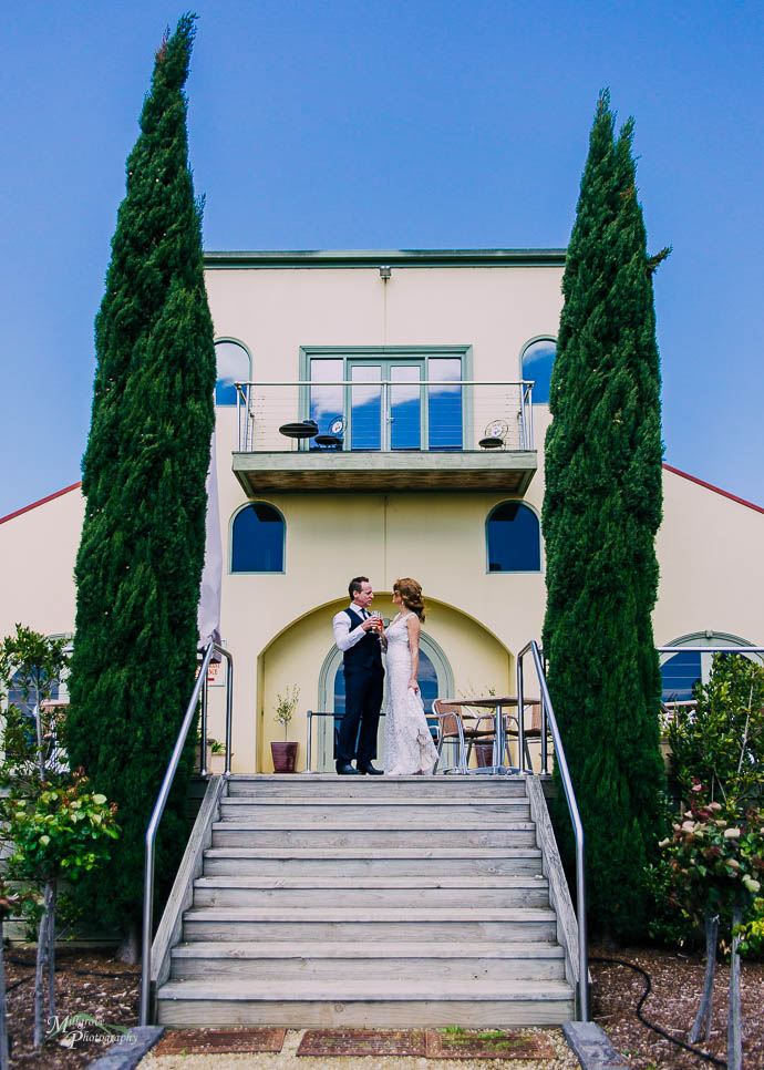 Bride and groom on the steps outside Tokar Estate, Coldstream