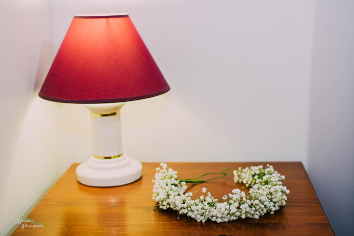 A floral headpiece with a lamp
