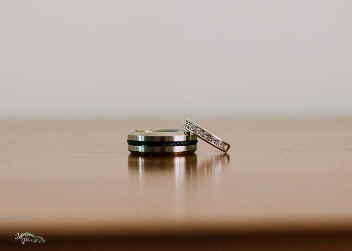 Wedding rings on a timber table