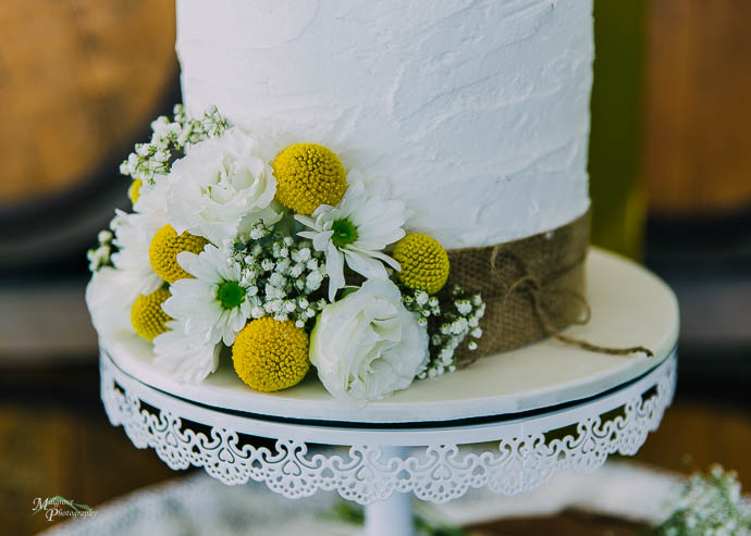 Yellow and white flowers on wedding cake