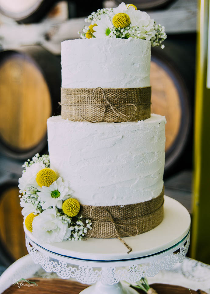 Yellow and white flowers on wedding cake