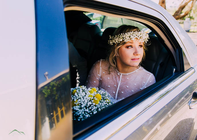 Bride looking out of limo window