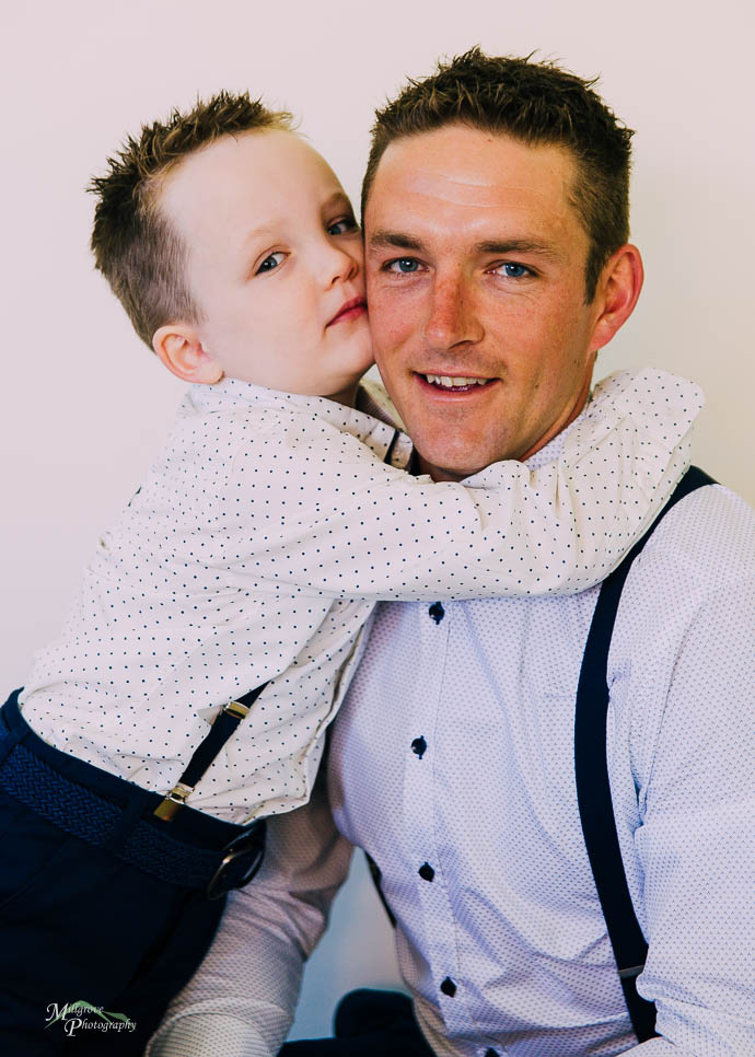 Little boy hugging his Dad, pre-wedding
