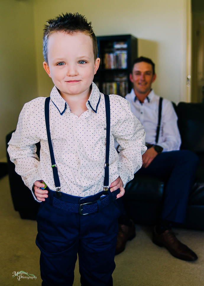 Little boy with Dad in background
