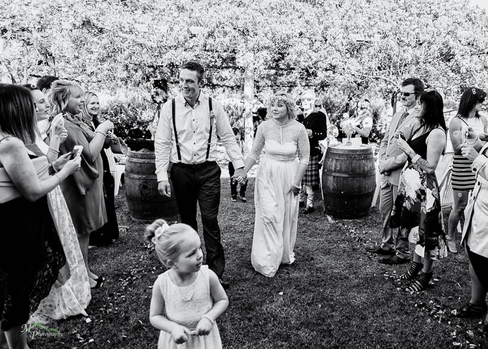 Bride and groom walking up the aisle after Wedding ceremony at T