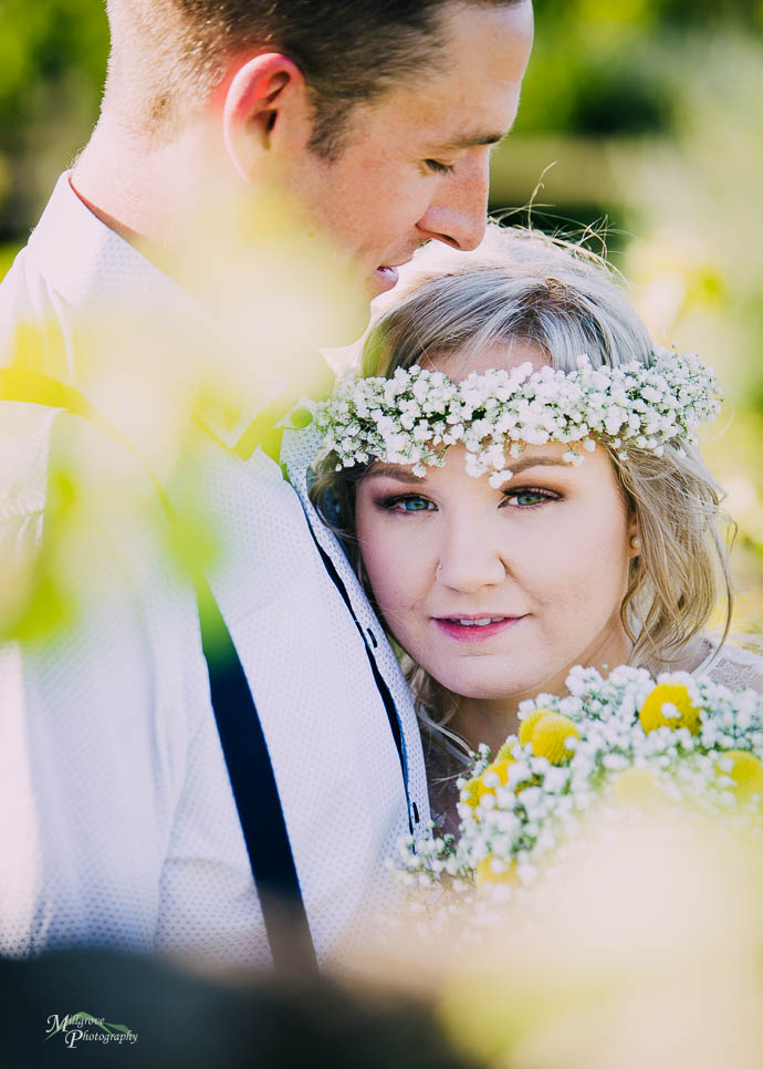 Bride and groom snuggling up after a wedding at Two Brookes Bist