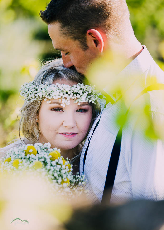 Bride and groom snuggling up after a wedding at Two Brookes Bist