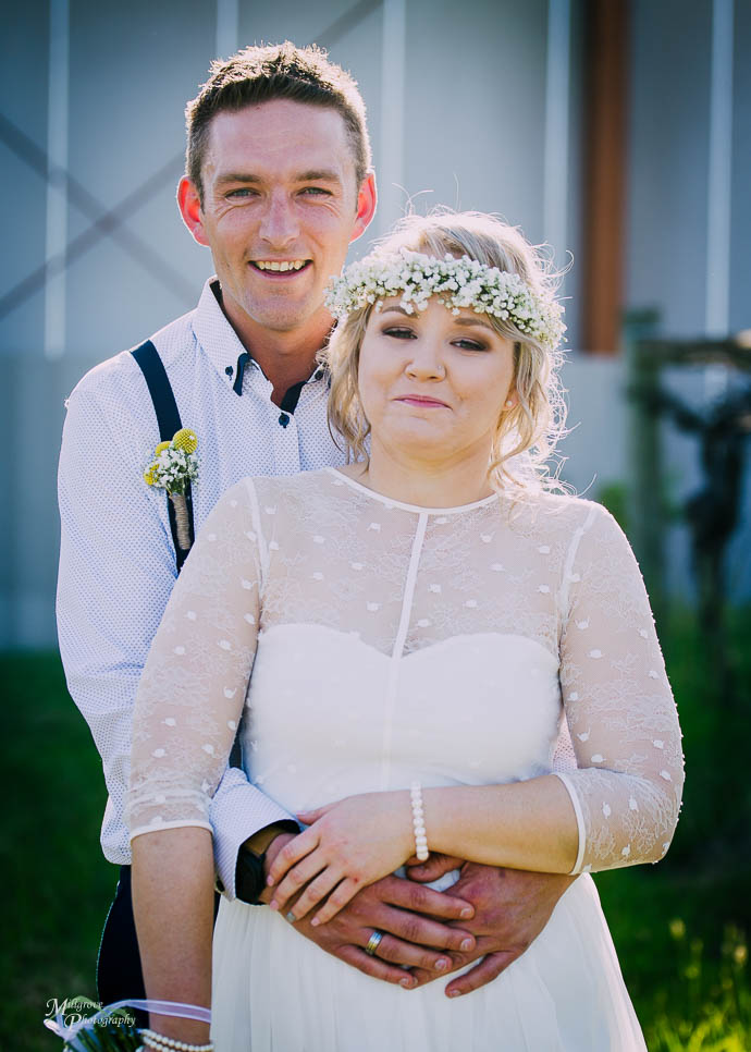Bride and groom snuggling up after a wedding at Two Brookes Bist