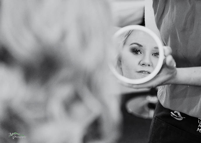 Bride reflected in a round mirror