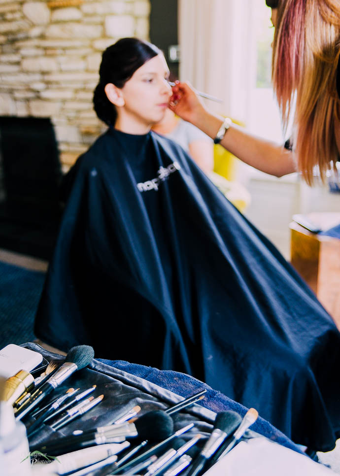 Bride getting her makeup finished