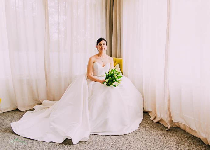 Bride getting ready in the bridal suite at Lake House, Daylesfor